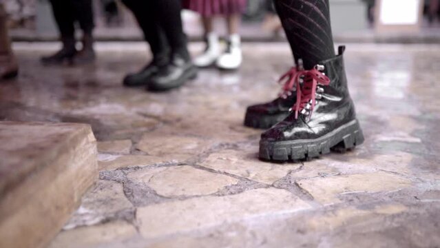 Close up of a woman practicing tap dance wearing urban black boots
