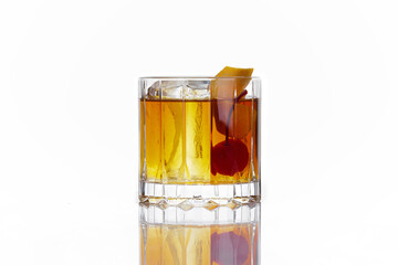 alcoholic cocktail of yellow color with a cherry, in an old-fashioned glass