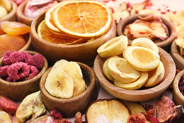 Colorful mix of various dried fruits: apricot and strawberry, fig and cherry, pineapple and raisin, pear and banana; healthy diet snack; vegan food background, selective focus