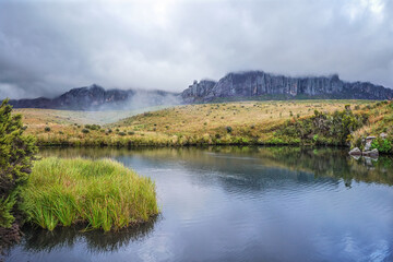 Andringitra Massif as seen from base camp during trek to Pic Boby (Madagascar highest accessible peak), small river flowing in foreground