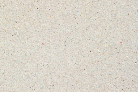 Texture of vintage paper, cardboard, recyclable material with villi, fluff, other inclusions, grunge background