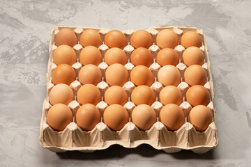 Chicken eggs in egg carton on gunny sack. High quality photo