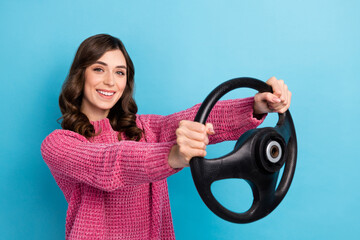 Photo of adorable lovely lady wear stylish clothes driving own new car enjoy weekend trip empty space isolated on blue color background