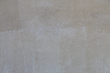 Rough textural surface of the wall, plastered for finishing. Backdrop for design, graphic resource. Texture background