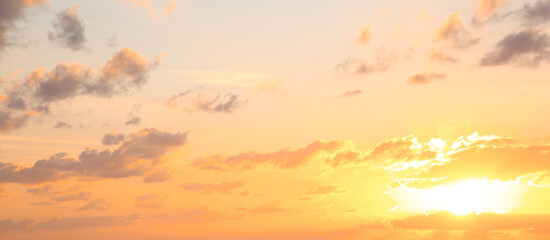 Fototapeta na wymiar Beautiful panorama of sky with clouds at sunset. Banner design
