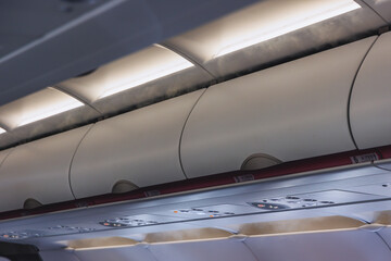 Closed hand luggage compartments in a cabin of passenger plane
