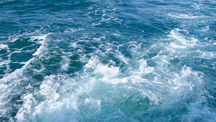 Fototapeta na wymiar Splash sea wave from cruise ship. Ocean wake and foam
