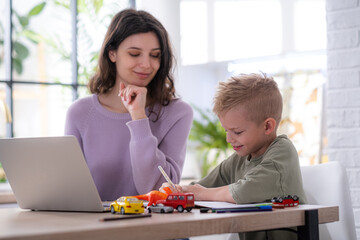 Work from home and family education, Mom and son using remote access technology for learning and...