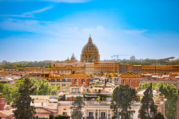 Fototapeta na wymiar Panorama of Rome and Basilica of St. Peter in a summer day in Vatican. Beautiful view of cityscape of Rome.Architecture and landmarks. Old famous streets, attractions and world heritage