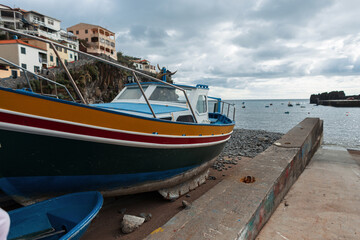 Fishing boat on the pier in a fishing village on the island of Madeira