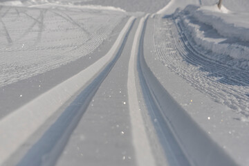 Ski snowy tracks with white frosty snow near Hall willage in Austria