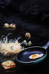 Quail eggs on a black background.Levitation.Homemade food.