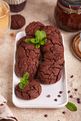 Chocolate brownie cookies with chocolate chips and cracks. Delicious homemade dessert.