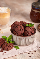 Chocolate brownie cookies with chocolate chips and cracks. Delicious homemade dessert.