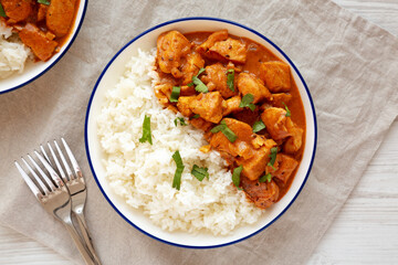 Homemade Easy Indian Butter Chicken with Rice on a Plate, top view. Flat lay, overhead, from above.