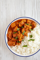 Homemade Easy Indian Butter Chicken with Rice on a Plate, top view. Flat lay, overhead, from above. Copy space.