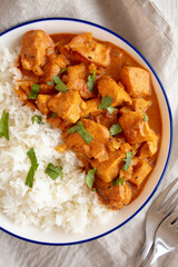 Homemade Easy Indian Butter Chicken with Rice on a Plate, top view. Flat lay, overhead, from above.