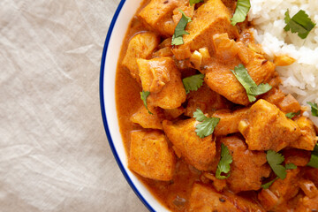 Homemade Easy Indian Butter Chicken with Rice on a Plate, top view. Flat lay, overhead, from above. Copy space.