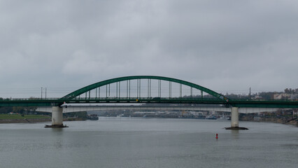 Old bridge across Sava river in Belgrade, green arch bridge