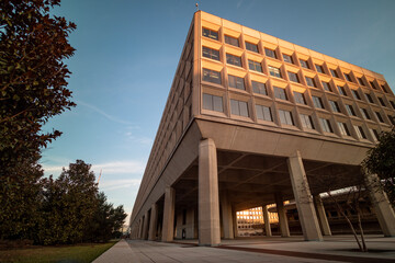 The golden hour light is cast on the James V. Forrestal Building, the headquarters of the United States Department of Energy, in downtown Washington, DC at sunset.