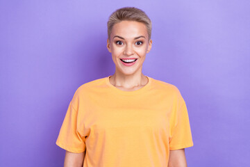 Portrait of funny positive girl shocked wear orange trendy t-shirt white short hair unexpected cheap clothes ad isolated on purple color background
