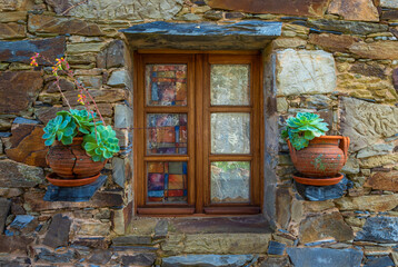 Fototapeta na wymiar View of a typical window in Figueira one of the 27 Schist villages in Portugal, that were been partially or fully recovered in order to maintain the traditions and memories of the pass.