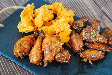 caramelized chicken with sesame and garlic, meat strips in breadin.