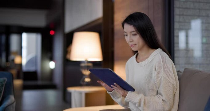 Woman use of tablet computer at home