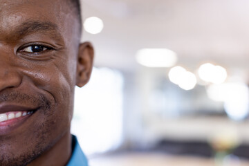 Portrait of happy african american businessman in modern office