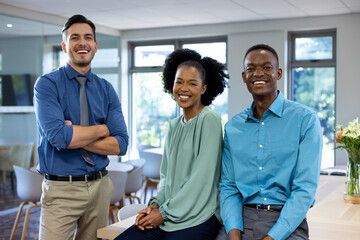Portrait of happy diverse business people in modern office