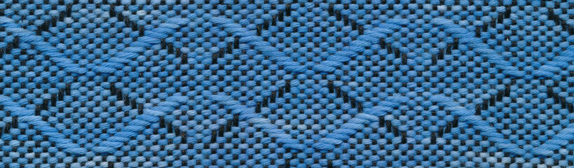 Close-up handwoven wavy pattern in black, blue and white.