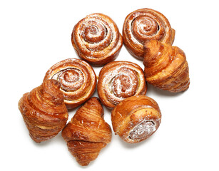 Fototapeta premium Delicious croissants and cinnamon rolls isolated on white background