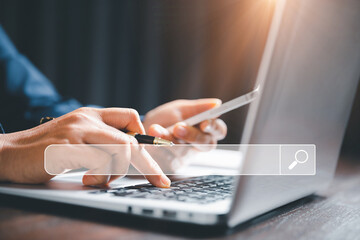 Search Engine Optimization SEO, data searching technology. business hands typing on laptop computer...