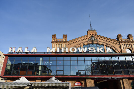 Hala Mirowska food market, facade with signage. WARSAW, POLAND - FEBRUARY 12, 2023