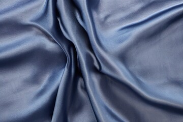 Fototapeta na wymiar Draped dark blue silk fabric background texture