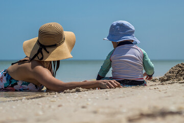 mom and children on the beach