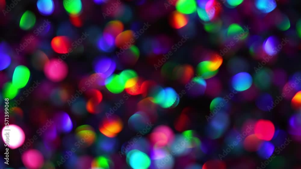 Sticker circular motion multicolored bokeh spots on dark. creative dotted light leaks animated background. a