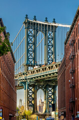 Brooklyn, New York, USA - April 25, 2022: View of Manhattan bridge from Dumbo district in Brooklyn....
