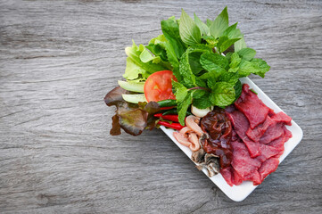 raw beef meat cuts slices on white plate and fresh vegetables fresh meat top view - beef  sashimi ,...