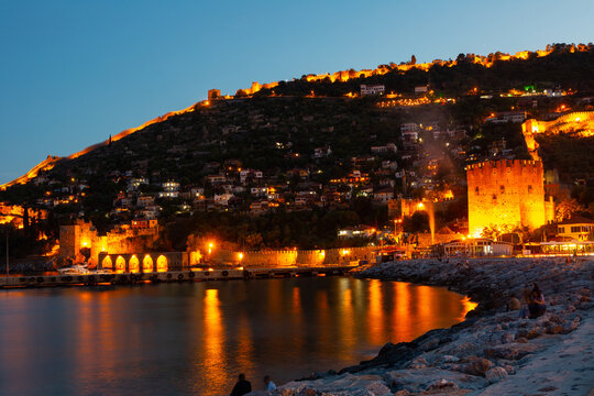 Red Tower and Tersane shipyard in twilight. Alanya, Antalya Province, southern coast of Turkey.