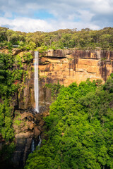 Fototapeta na wymiar Fitzroy Falls is one of the most spectacular waterfalls in Australia. It drops 80m down the escarpment into the valley below. Located in Morton National Park, Southern Highlands, NSW, Australia.