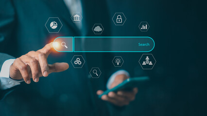 Businessman showing Search Bar On Virtual Screen, Data Search Technology Search Engine Optimization. Man use smart phone to Searching for information. Using Search Console with your website.