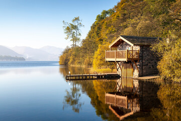 Duke of Portland Boathouse on a bright misty morning, Ullswater in the Lake District.