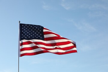 American flag fluttering outdoors on sunny day