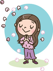 桜の花びらと若い女性