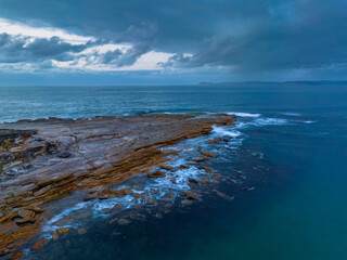 Rain cloud sunrise over the beach and mountain