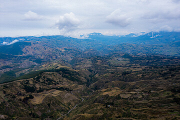 Aerial view of the steep hills and ravines high up in the mountains of the andes