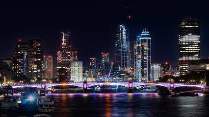 Fototapeta na wymiar city skyline with bridge at night in London