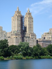 long exposure photo of a view of the city towers from the river from the central park  in a day of spring, manhattan island, new york city nature plants and outdoors 