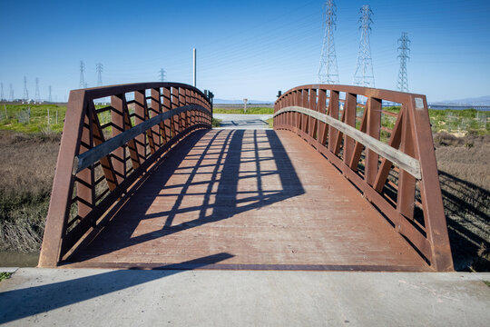 Metal bridge with wooden railings